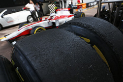 Pirelli tyres in the pit lane, as Sergey Sirotkin, ART Grand Prix passes