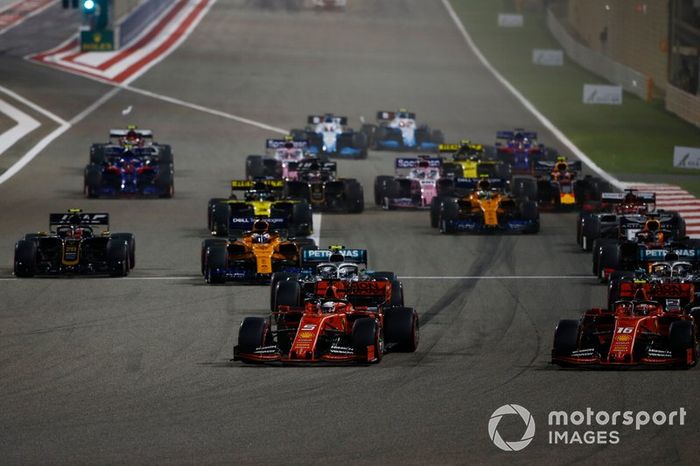Sebastian Vettel, Ferrari SF90, Charles Leclerc, Ferrari SF90, Lewis Hamilton, Mercedes AMG F1 W10, Valtteri Bottas, Mercedes AMG W10, Max Verstappen, Red Bull Racing RB15, Kevin Magnussen, Haas F1 Team VF-19, and the rest of the field at the start