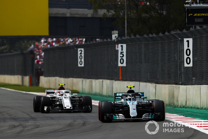 Valtteri Bottas, Mercedes AMG F1 W09 EQ Power+, leads Charles Leclerc, Sauber C37