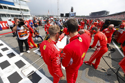 Sebastian Vettel, Ferrari, talks to an engineer on the grid