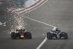 Sparks fly as Max Verstappen, Red Bull Racing RB14 Tag Heuer, battles with Lewis Hamilton, Mercedes