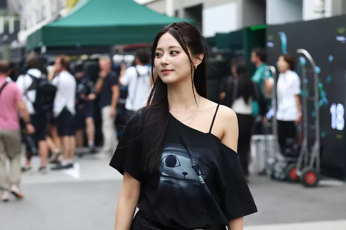 Tzuyu walks in the Paddock
