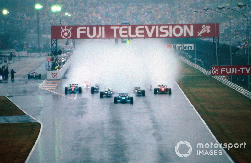 Michael Schumacher, Benetton B194 leads at the start of the very wet race