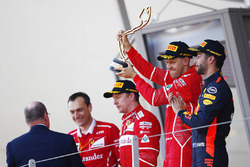 Race winner Sebastian Vettel, Ferrari, second place Kimi Raikkonen, Ferrari, third place Daniel Ricciardo, Red Bull Racing