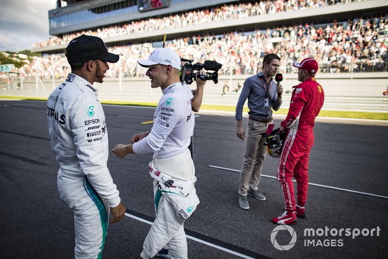 Lewis Hamilton, Mercedes AMG F1, congratulates his team mate Valtteri Bottas, Mercedes AMG F1