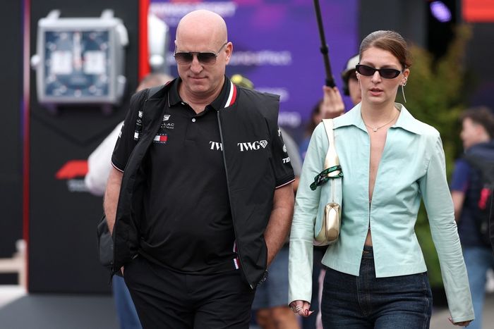 Cadillac F1 Team CEO Dan Towriss walks through the paddock with his wife Cassidy Towriss 