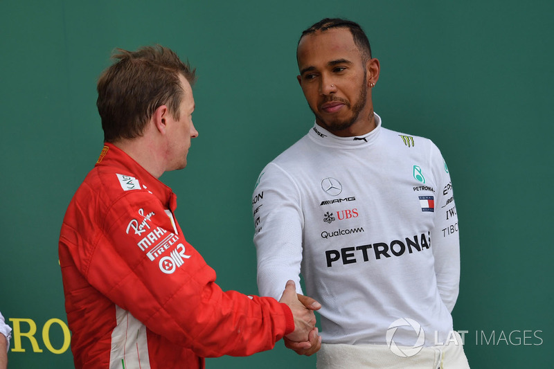 Kimi Raikkonen, Ferrari and Lewis Hamilton, Mercedes-AMG F1 celebrate on the podium