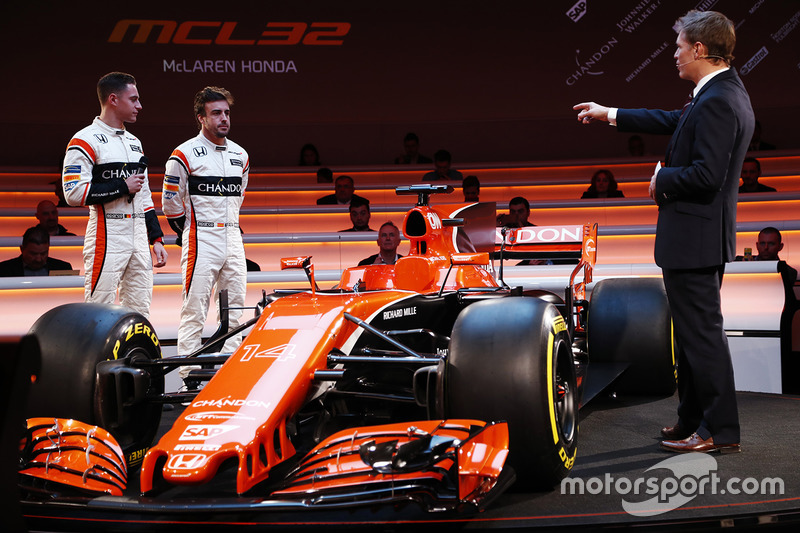 Race drivers Stoffel Vandoorne and Fernando Alonso on stage with presenter Simon Lazenby at the laun