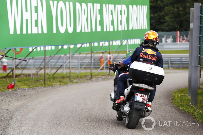 Max Verstappen, Red Bull Racing on a motorcycle after retiring