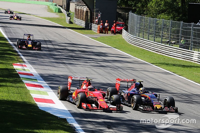 Kimi Raikkonen, Ferrari SF15-T and Carlos Sainz Jr., Scuderia Toro Rosso STR10