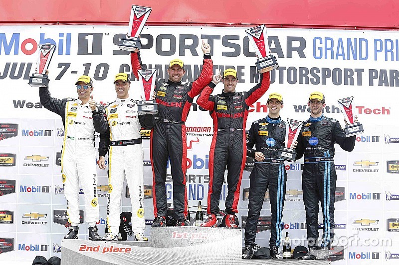 Podium: winners #31 Action Express Racing Corvette DP: Eric Curran, Dane Cameron, second place #5 Ac