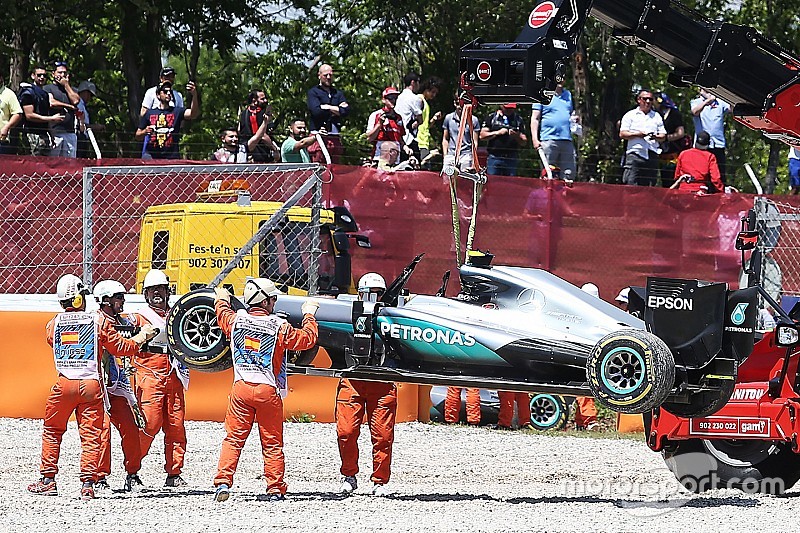 The Mercedes AMG F1 W07 Hybrid of race retiree Nico Rosberg, Mercedes AMG F1 is craned away from the gravel trap at the start of the race