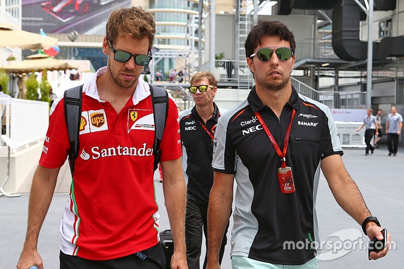 (L to R): Sebastian Vettel, Ferrari with Sergio Perez, Sahara Force India F1