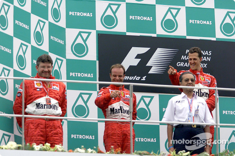 Ross Brawn, Rubens Barrichello and Michael Schumacher on the podium