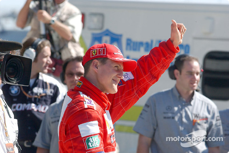 On the grid: Michael Schumacher waiving