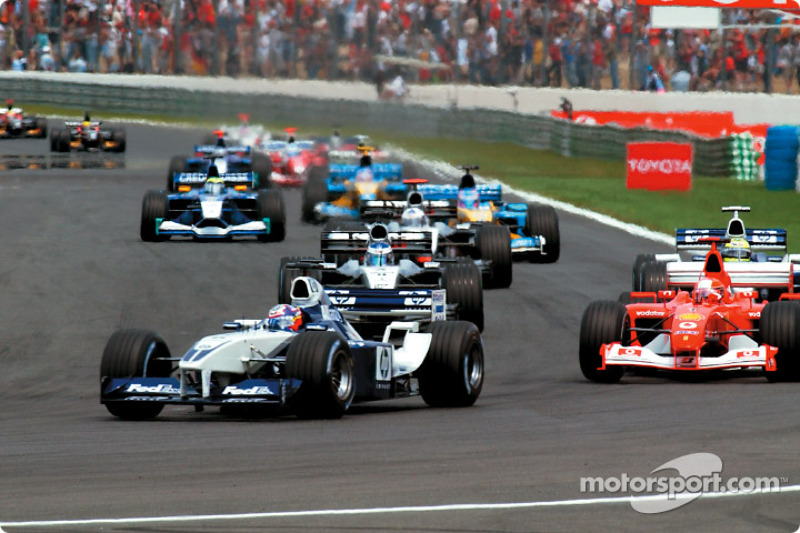 The start: Juan Pablo Montoya leading Michael Schumacher