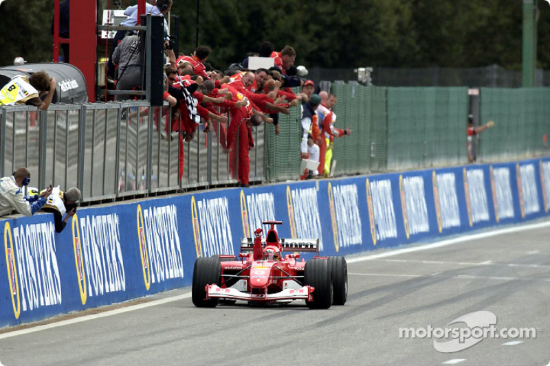 Michael Schumacher taking the checkered flag