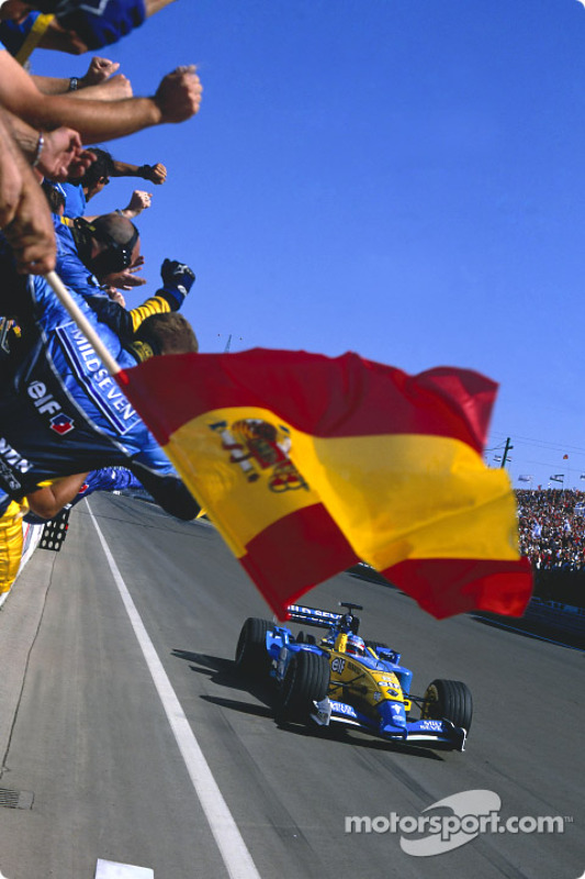 Race winner Fernando Alonso celebrates