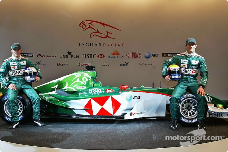 Christian Klien and Mark Webber pose with the new Jaguar R5