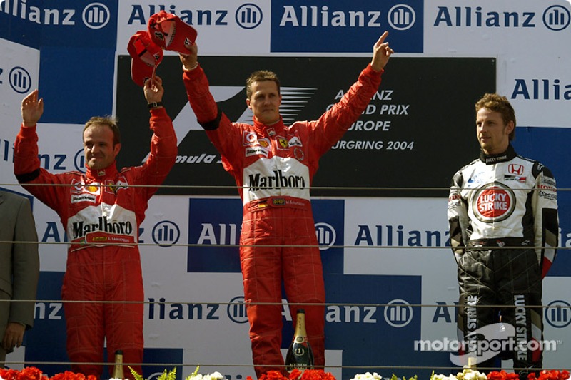 Podium: race winner Michael Schumacher with Rubens Barrichello and Jenson Button