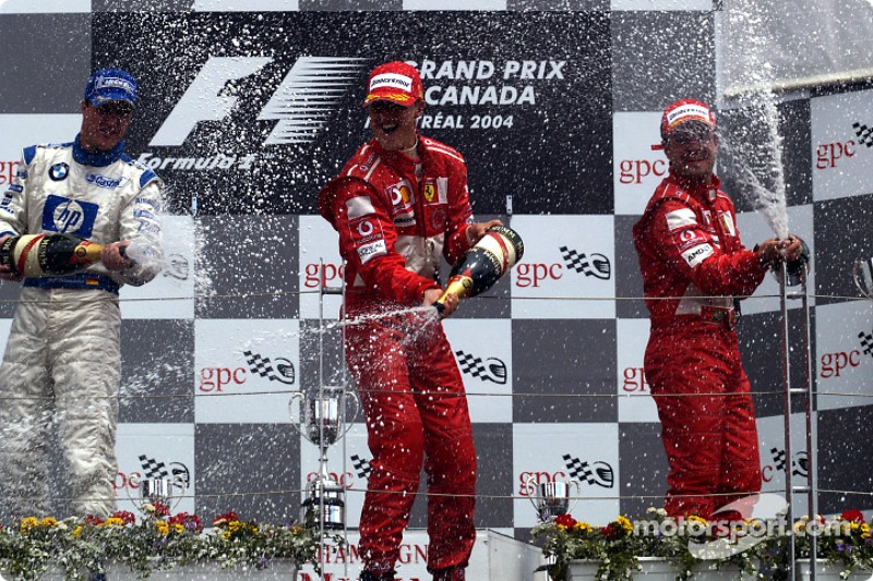 Podium: champagnefor race winner Michael Schumacher, Ralf Schumacher and Rubens Barrichello