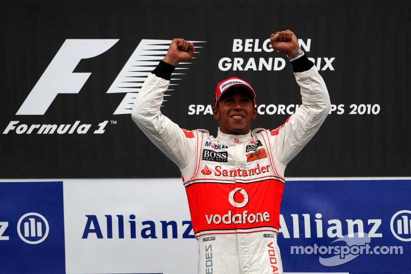 Podium: race winner Lewis Hamilton celebrates