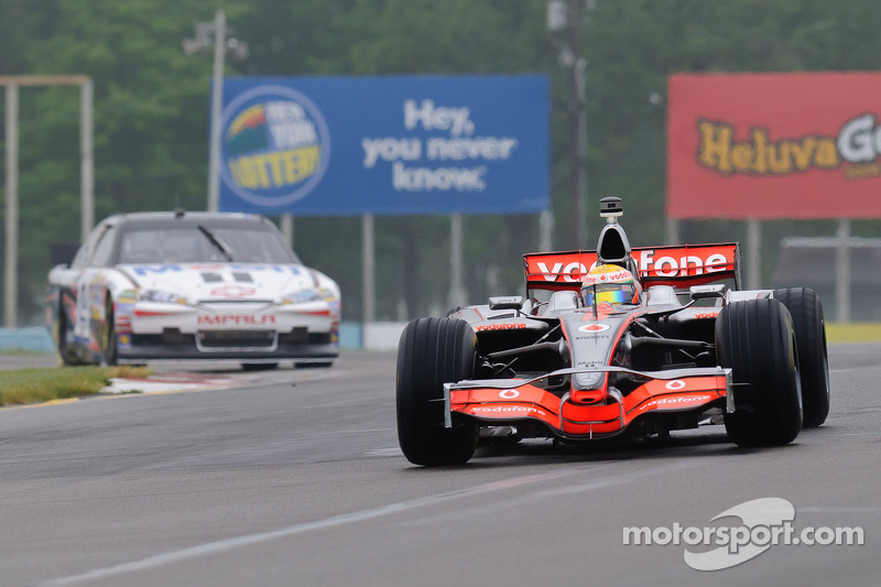 Lewis Hamilton in his McLaren MP4-23 and Tony Stewart in his Chevy Impala Sprint Cup car