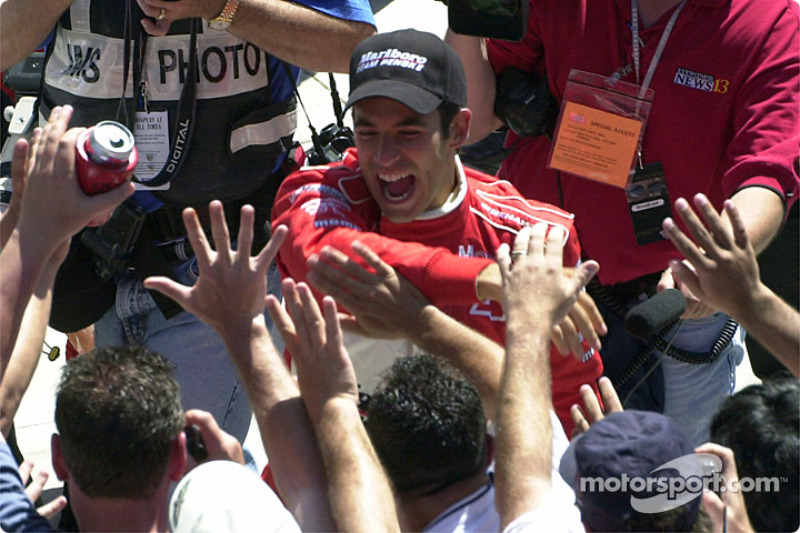 Castroneves throws himself into the crowd