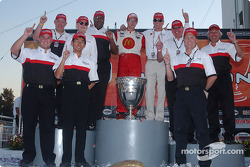 Race winner and 2004 Champ Car World Series champion Sébastien Bourdais celebrates with Carl Haas and Paul Newman