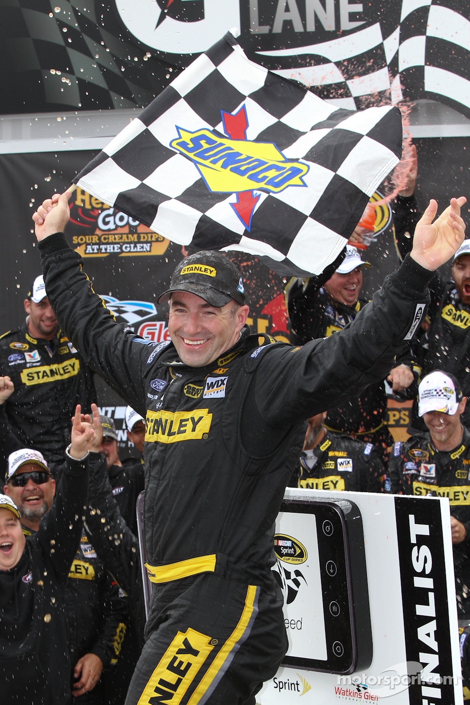 Victory lane: race winner Marcos Ambrose, Petty Motorsport Ford celebrates