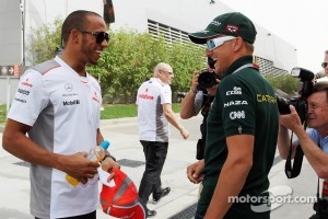 Lewis Hamilton, McLaren with Heikki Kovalainen, Caterham