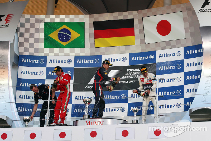 First place for Sebastian Vettel, Red Bull Racing second place for Felipe Massa, Scuderia Ferrari and third place for Kamui Kobayashi, Sauber F1 Team