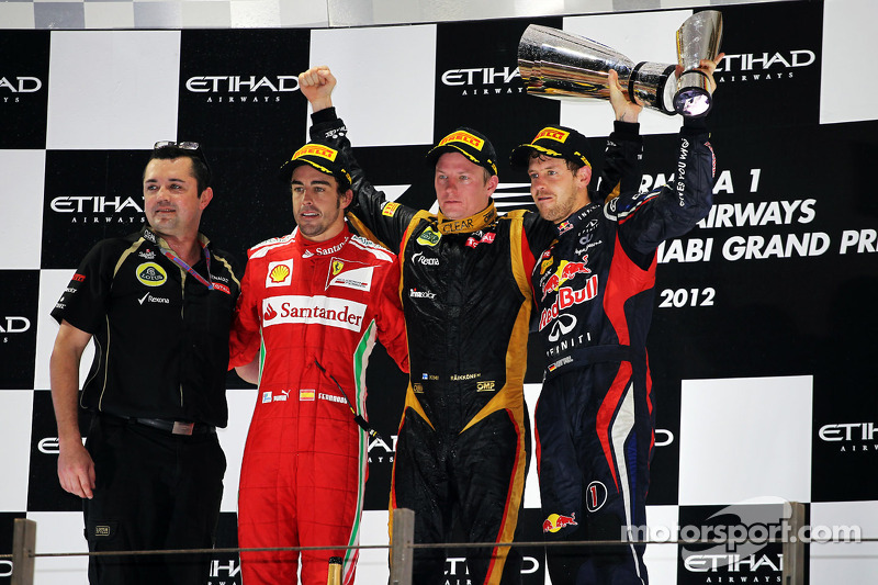 The podium: second place Fernando Alonso, Ferrari, race winner Kimi Raikkonen, Lotus F1 Team, third place Sebastian Vettel, Red Bull Racing