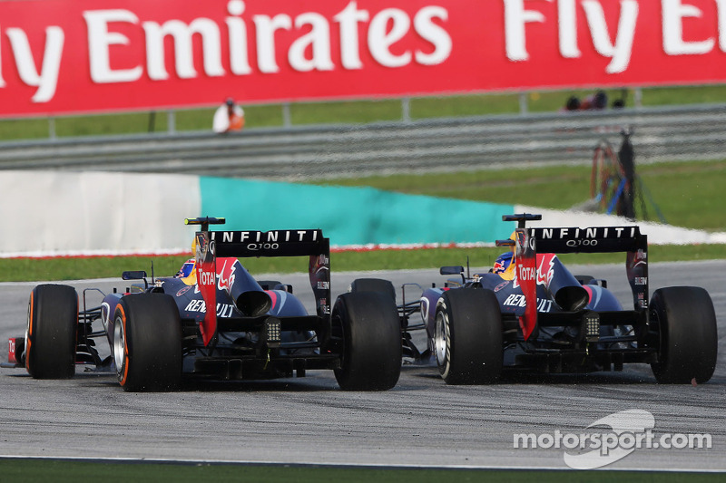 Sebastian Vettel, Red Bull Racing RB9 and team mate Mark Webber, Red Bull Racing RB9 battle for the lead of the race