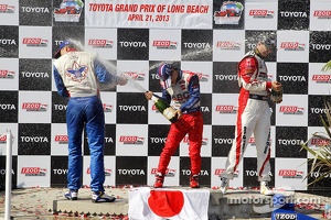 Victory circle: race winner Takuma Sato, A.J. Foyt Enterprises Honda, second place Graham Rahal, Rahal Letterman Lanigan Racing Honda, third place Justin Wilson, Dale Coyne Racing