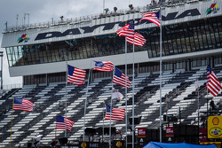 American flags wave over Daytona International Speedway garage area