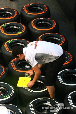 McLaren mechanic with Pirelli tyres