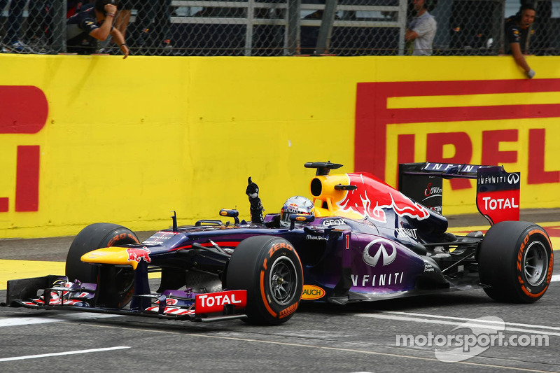 Race winner Sebastian Vettel, Red Bull Racing RB9 celebrates at the end of the race