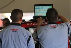Hendrick engine technicians work in the garage