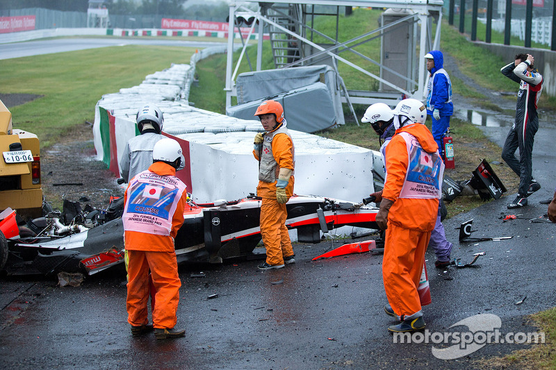 Adrian Sutil, Sauber F1 Team looks on as the safety team at work after the crash of Jules Bianchi, Marussia F1 Team 