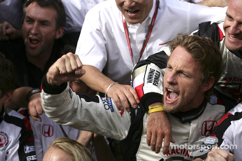 Race winner Jenson Button celebrates with Honda Racing F1 team members