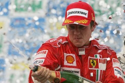 Podium: champagne for Kimi Raikkonen