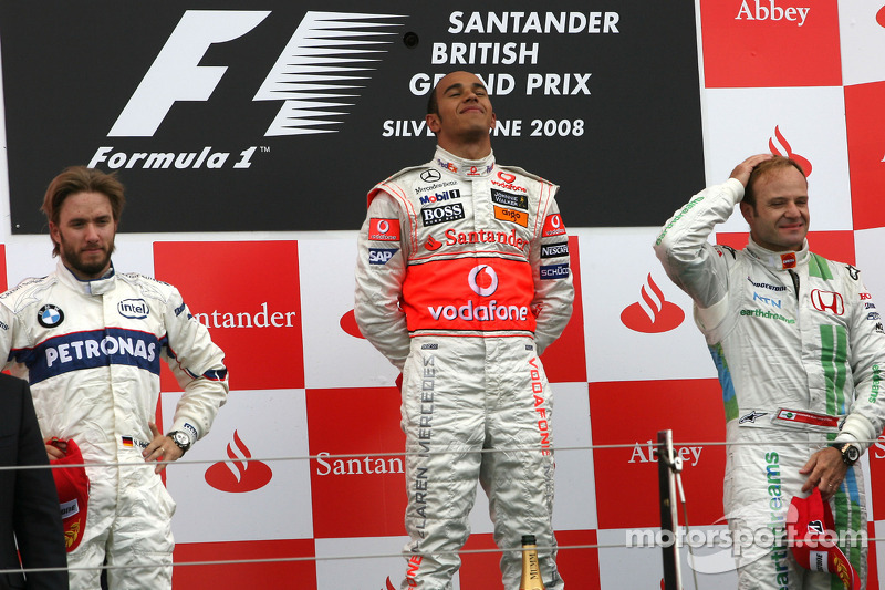 Podium: race winner Lewis Hamilton with second place Nick Heidfeld and third place Rubens Barrichello