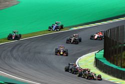 Fernando Alonso, McLaren MP4-30 and Marcus Ericsson, Sauber C34 run wide at the start of the race