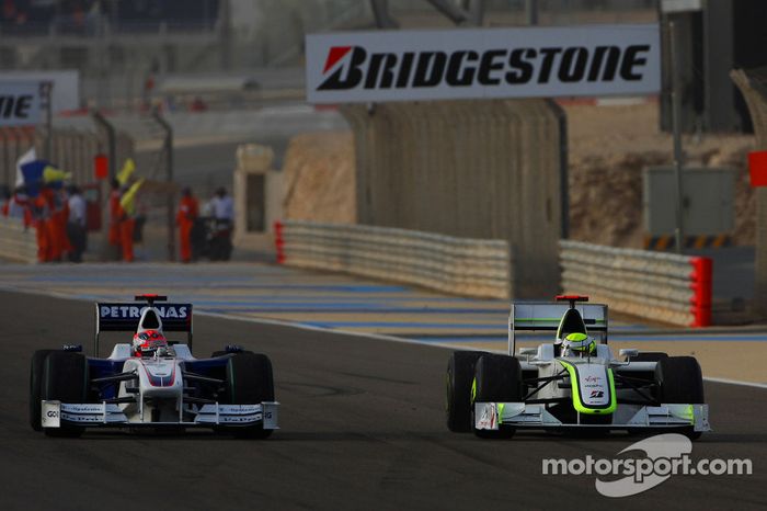 Jenson Button, Brawn GP y Robert Kubica, BMW Sauber F1 Team
