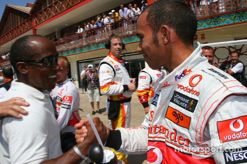 Pole winner Lewis Hamilton, McLaren Mercedes celebrates with his father Anthony Hamilton