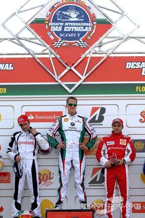 First race podium: winner Michael Schumacher, second place Vitantonio Liuzzi, third place Felipe Mas